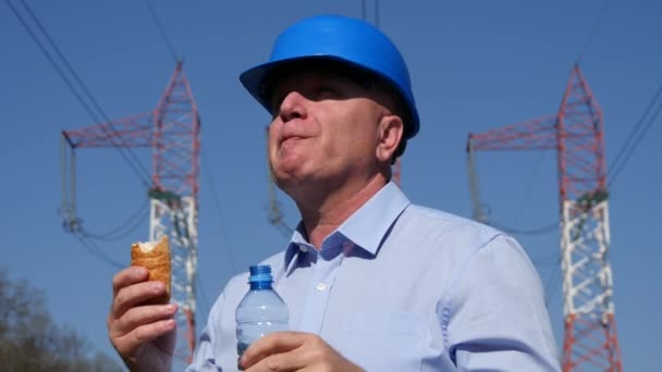 Electricity Engineer Working Take a Lunch Break Eating Snack Drink Fresh Water - Materiał filmowy, wideo