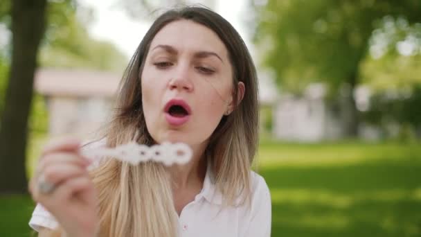 Girl making soap bubbles. Slow motion - Video
