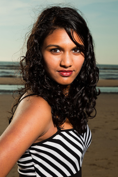 Pretty indian girl with long hair on the beach in summer. - Fotoğraf, Görsel