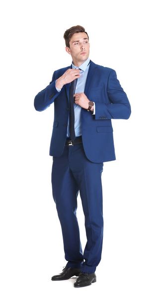 Handsome young man in suit on white background - 写真・画像