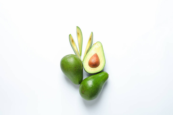 Composition with ripe fresh avocados on white background - Foto, imagen
