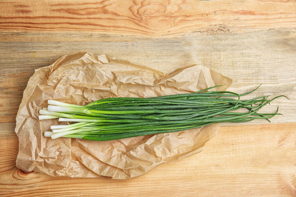 Fresh green onion on table, top view - Фото, изображение