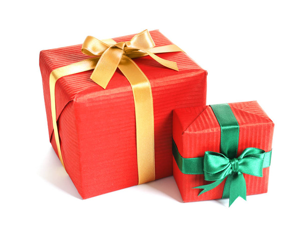 Beautifully wrapped gift boxes on white background - Foto, Imagen