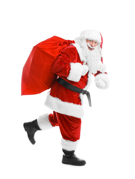Auténtico Santa Claus con bolsa roja llena de regalos sobre fondo blanco
 - Foto, Imagen