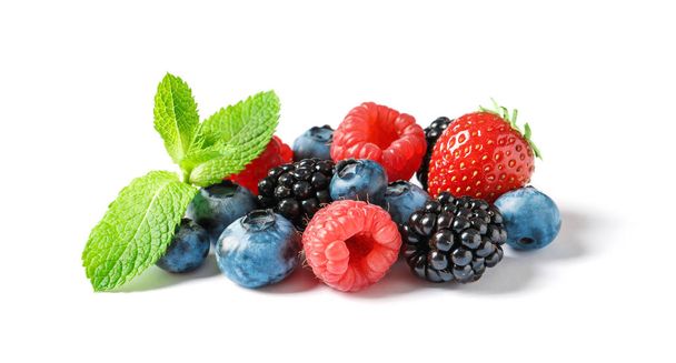 Raspberries and different berries on white background - Φωτογραφία, εικόνα