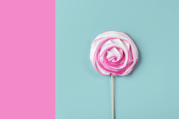 Pink candy on blue pastel background. lay flat style. - Photo, Image