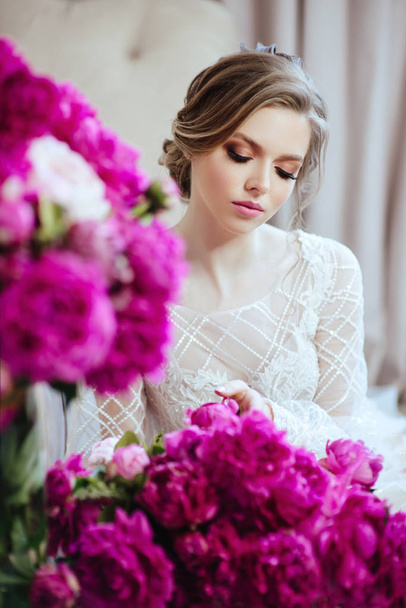 Beautiful model girl , with flowers peony near the face . Cosmetics , beauty, makeup, wedding and cosmetology . - 写真・画像
