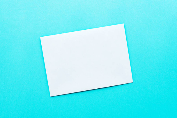 White mail envelope mock up on blue background - Fotó, kép