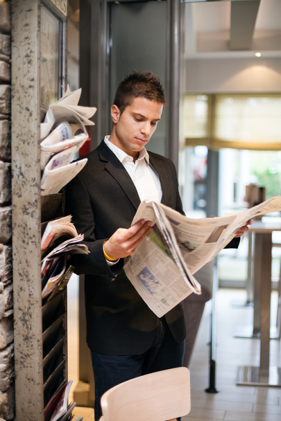 Businessman reading newspaper - Фото, зображення