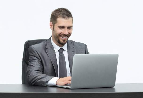 closeup.happy businessman working on laptop, sitting at desk - Zdjęcie, obraz