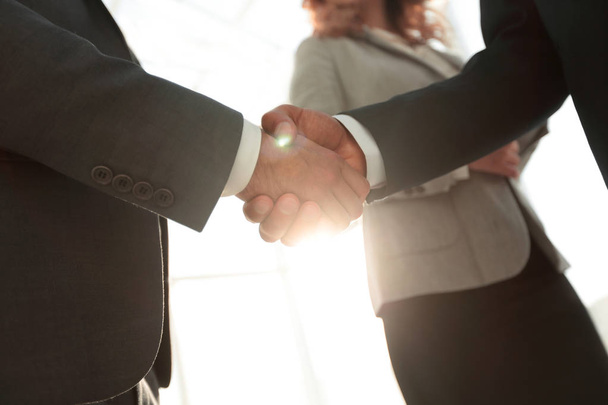 Close up business man handshake together on meeting room - Fotó, kép