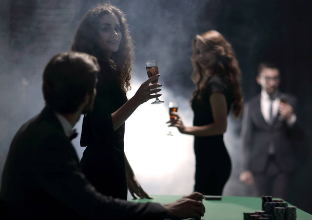 young people with glasses of wine in a casino - Fotografie, Obrázek