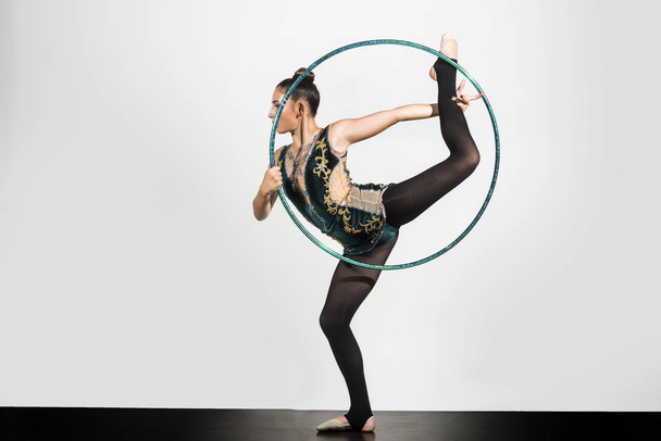 sports activities in gym of flexible girl. sport activity of woman in with hula hoop - Foto, Imagem