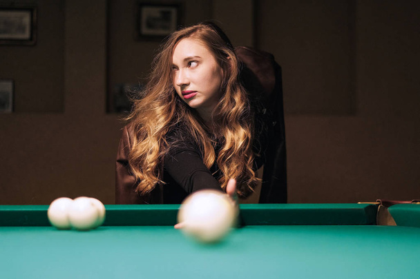 girl in the billiard room - Фото, изображение