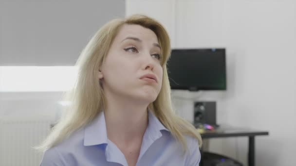Overworked young businesswoman looking stressed and exhausted at office feeling upset about failing tasks - Záběry, video