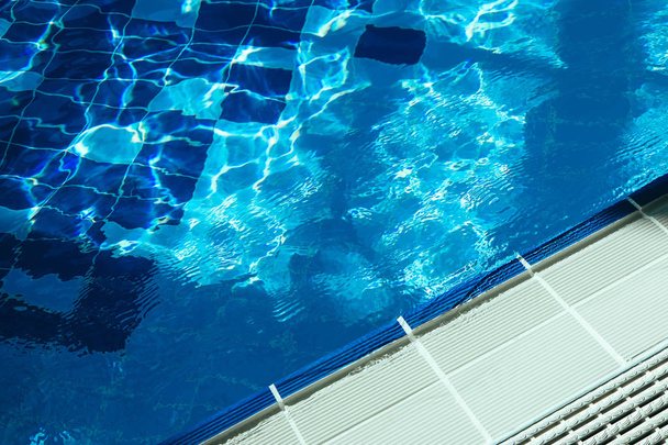 Bottom of the swimming pool, side . Pool edge close up, water. - Photo, Image