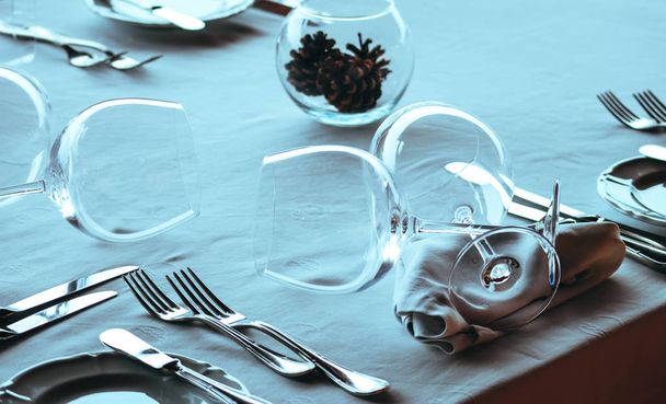 Elegant served table of luxury restaurant, vine glasses and napkin close up. - Фото, изображение