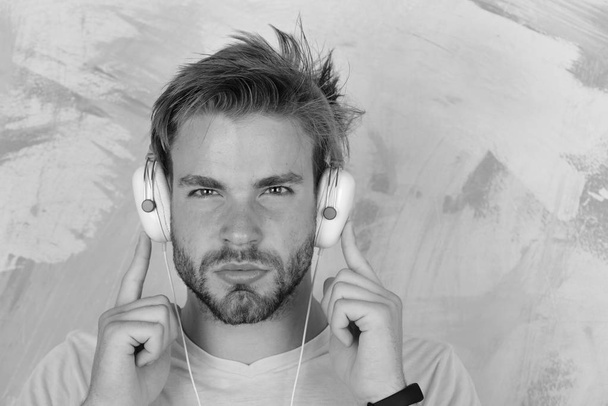European man have fun time. Musical lifestyle. American handsome bearded guy with headphones. - Zdjęcie, obraz