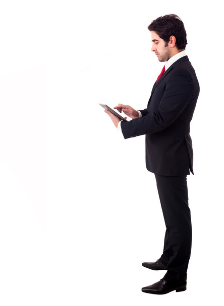 Young business man with tablet computer. Isolated over white bac - Photo, image
