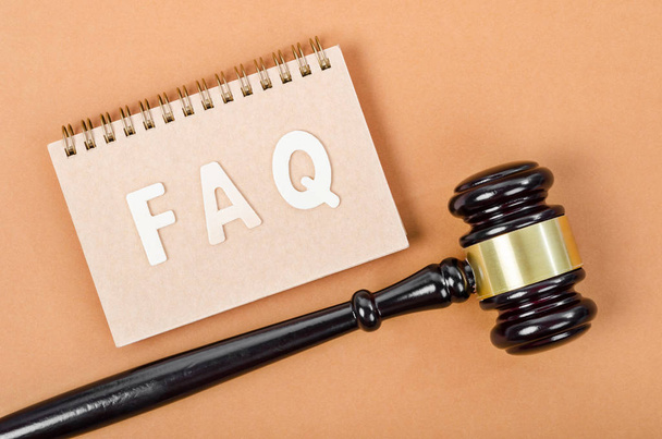 Frequently Asked Questions with judge hammer. FAQ Law concept. - Photo, Image