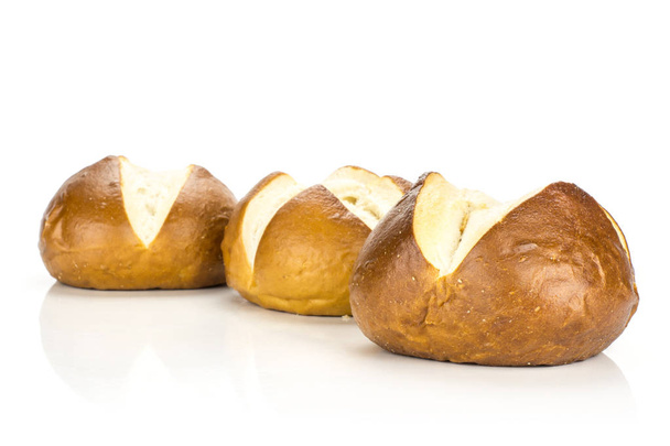 Fresh Bavarian bread buns isolated on white background three baked loaves in ro - 写真・画像