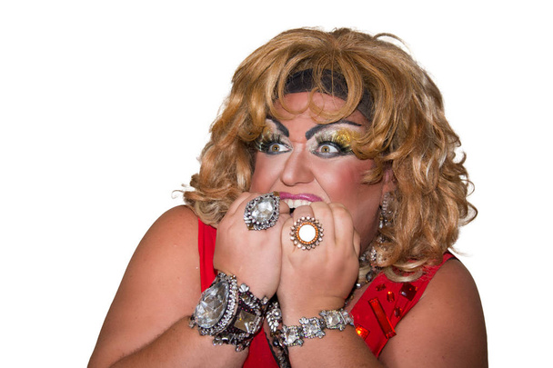 Funny travesty actor. Drag queen in red. Feelings and emotions. Fat man and make-up. Fright - Photo, Image