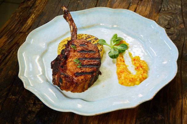 Roasted lamb ribs with spices and sauce on white plate. Shallow dof - Foto, Imagen