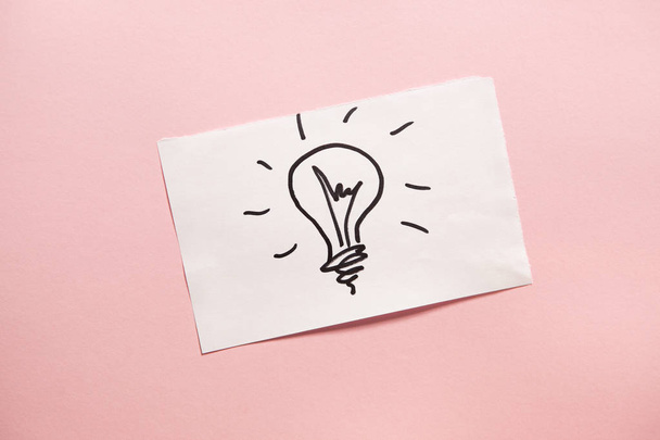 Light bulb on pink background, can be used as idea or energy concept - Foto, immagini