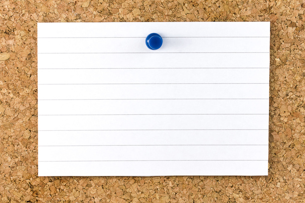 Horizontal Blank white striped sheet fixed on cork board with a blue small thumb tack - Photo, Image