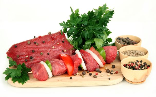 Raw beef meat marinated with herbs and spices isolated on white - Foto, Imagen