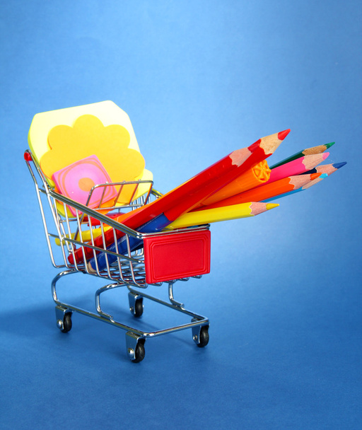 trolley with school equipment on blue background - Photo, Image