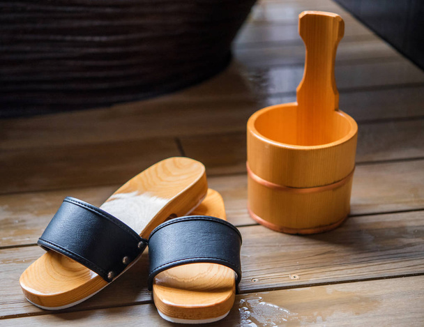 Wooden slippers and a barrel for accessories, Hanoke, Japan. Close-up - 写真・画像