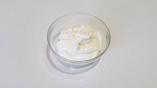 mascarpone cream in a transparent bowl - Zdjęcie, obraz