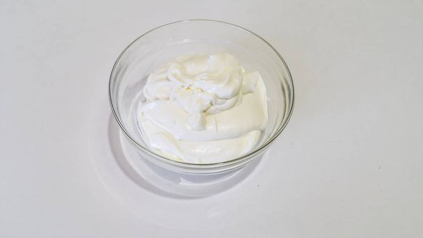 mascarpone cream in a transparent bowl - Foto, Imagen