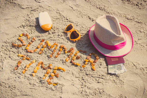 Vintage photo, Inscription summer time made of amber stones, accessories for sunbathing and passport with currencies euro at beach, concept of sunbathing, travel and vacation time - 写真・画像