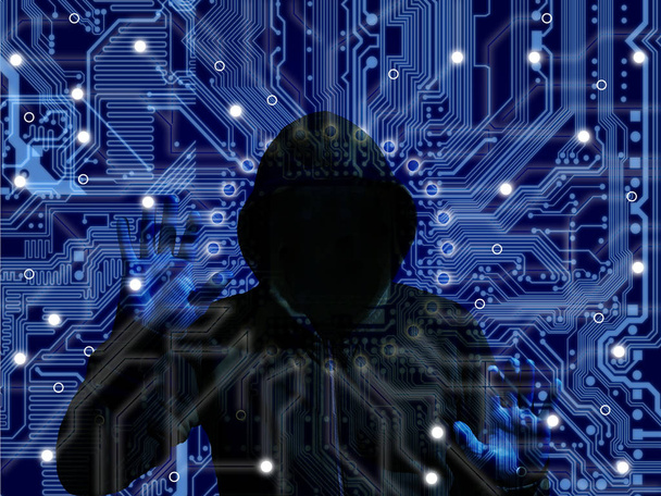 Black hooded hacker on a blue circuit background cybersecurity IOT concept - Photo, Image