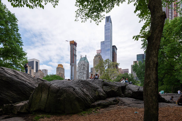 NEW YORK, UNITED STATES - MAY 21, 2018: People hanging out at Central Park on a sunny day in Manhattan, New York City - Fotó, kép