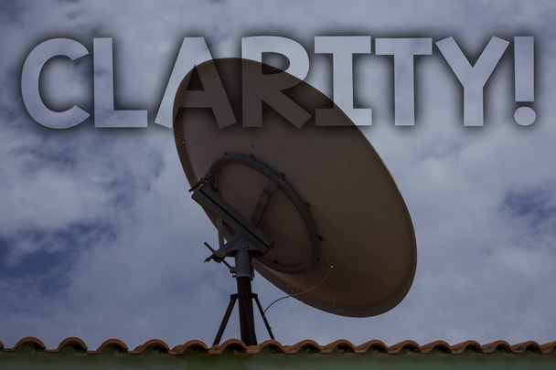 Conceptual hand writing showing Clarity. Business photo text Certainty Precision Purity Comprehensibility Transparency Accuracy Ideas messages television antenna cloudy sky old city house - Photo, Image
