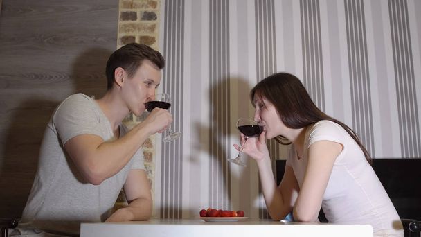 Romantic evening. Young couple at a table drinking wine. - Photo, Image