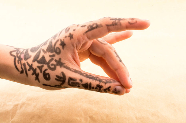Hand with tattoo on a background - Photo, Image
