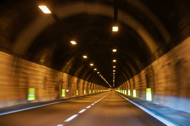 Driving by car through mountain tunnels. - Foto, Imagem