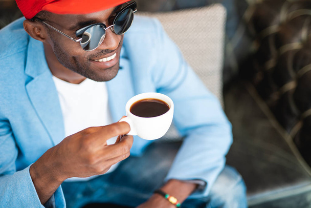 Positive male drinking cup of coffee - Zdjęcie, obraz