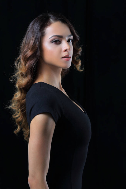 Beautiful and attractive model in black dress. - Foto, afbeelding