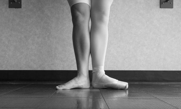 Black and white version of Behind the Ballet dancer's pointe shoes - Photo, Image