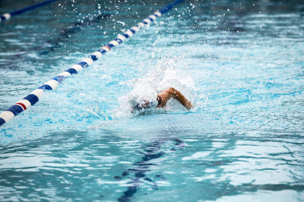 Teen female swimmer at a swim meet - Photo, Image