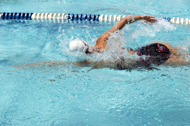 Teen female swimmer at a swim meet - Photo, Image