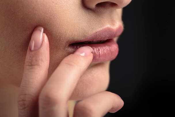 Closeup macro photo of woman's lips with natural lip balm - Фото, изображение
