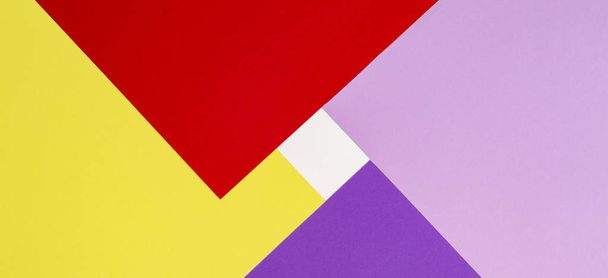 Color papers geometry flat composition background with violet, purple, pink, red, yellow tones. - Photo, Image