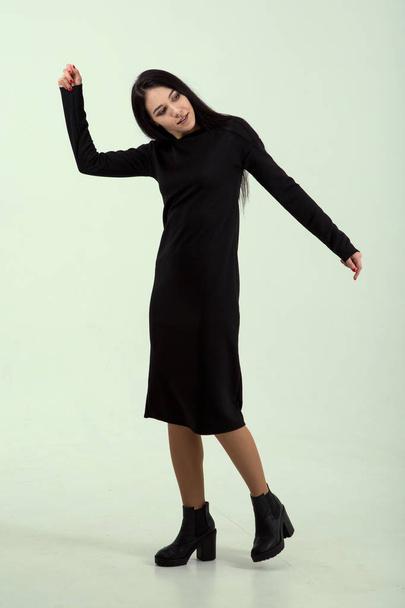 Woman in a black dress. Fashion model. - Φωτογραφία, εικόνα