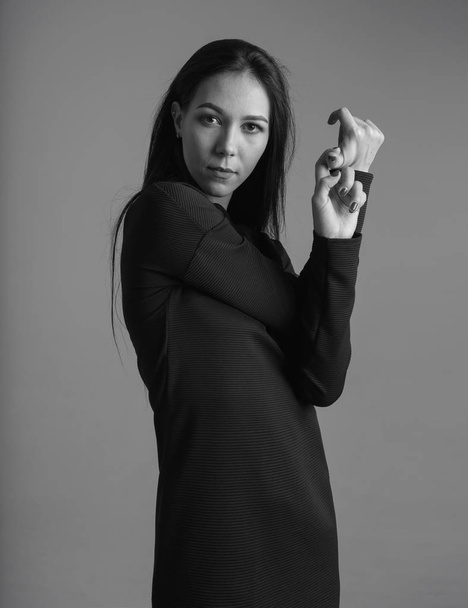 Black and white portrait fashion model. Woman in a black dress.  - Фото, зображення